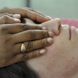 Student practicing giving Reiki session in Reiki training with Pamela Miles